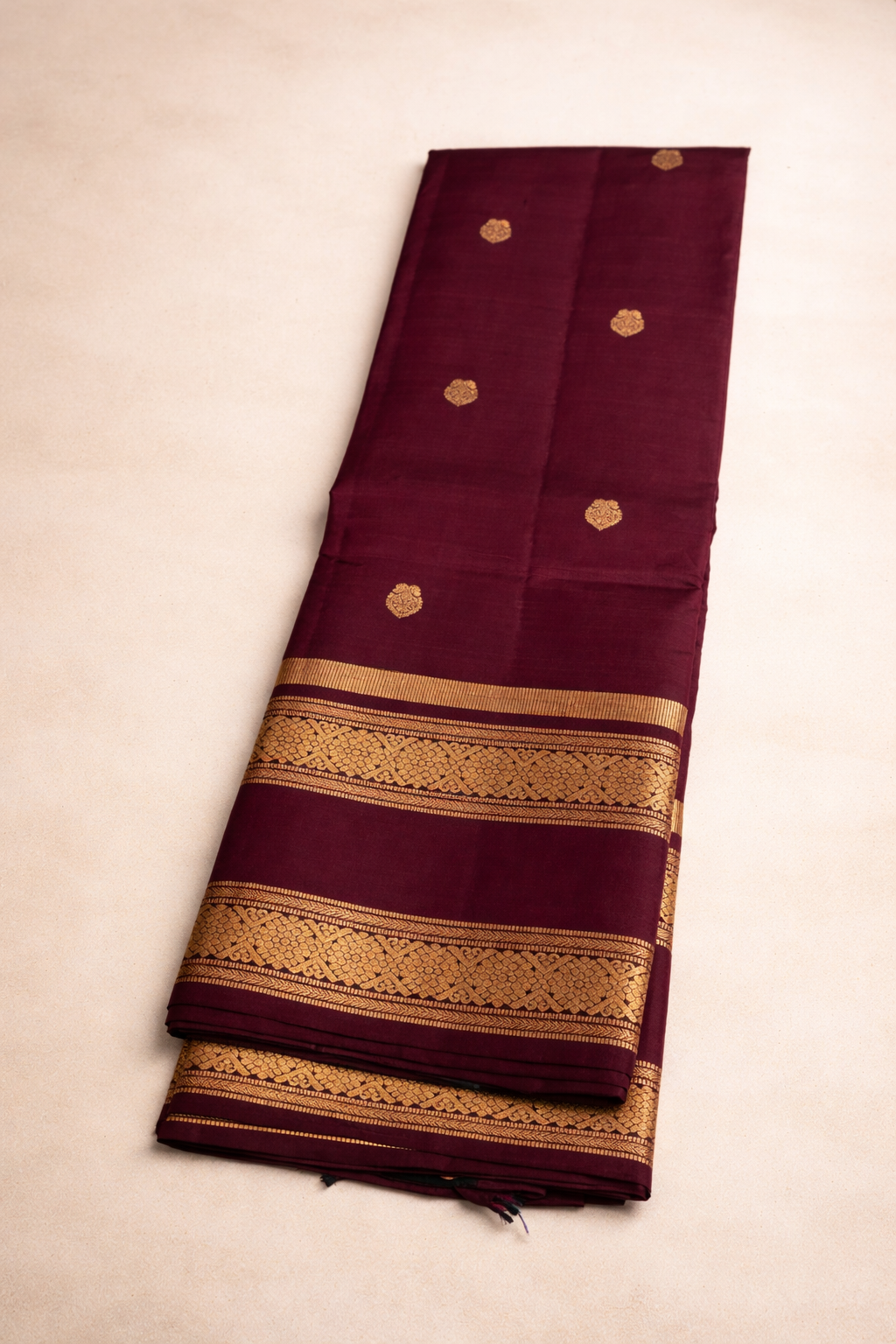 Maroon Pure Pattu Silk Saree with Rich Gold Zari Border & Traditional Motifs